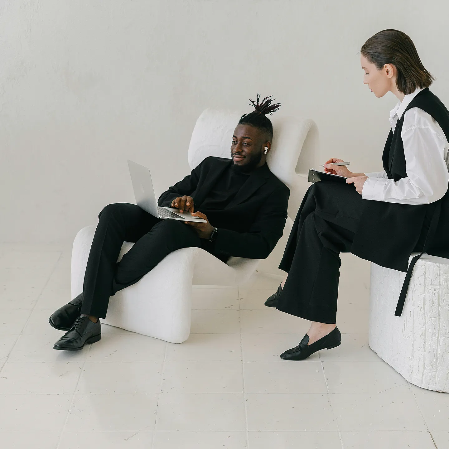 woman and man  sitting on a chair